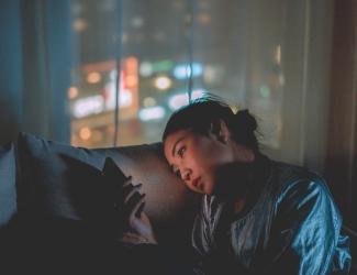 A woman on her phone while browsing the internet