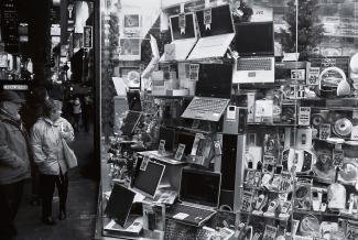 digital divide: a woman shopping for a computer 